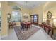 Formal dining room with a beautiful chandelier and traditional furnishings at 790 Shadow Bay Way, Osprey, FL 34229