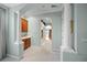 Elegant Primary suite hallway with columns and access to a luxurious bathroom at 790 Shadow Bay Way, Osprey, FL 34229