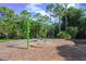 playground with swings set in a wooded area at 790 Shadow Bay Way, Osprey, FL 34229