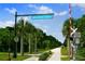 Entrance to The Legacy Trail with palm trees and signage at 790 Shadow Bay Way, Osprey, FL 34229