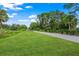 Scenic paved walking trail winds through lush greenery at 790 Shadow Bay Way, Osprey, FL 34229