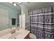 Clean bathroom with shower/tub combo, vanity, and patterned shower curtain at 8108 Haven Harbour Way, Bradenton, FL 34212