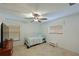 Bright bedroom with a daybed, ceiling fan, and window blinds at 8108 Haven Harbour Way, Bradenton, FL 34212