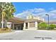 Elegant clubhouse entrance with stone accents and palm trees at 8108 Haven Harbour Way, Bradenton, FL 34212