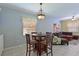 Small dining area with table and chairs, near a living room at 8108 Haven Harbour Way, Bradenton, FL 34212