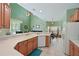 Kitchen with light wood cabinets and corner sink at 8108 Haven Harbour Way, Bradenton, FL 34212