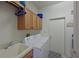 Convenient laundry room with washer, dryer, and ample storage cabinets at 8108 Haven Harbour Way, Bradenton, FL 34212