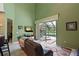 Relaxing living room with sliding glass doors opening to a pool and patio at 8108 Haven Harbour Way, Bradenton, FL 34212