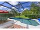 Relaxing screened pool and patio with colorful rug and lounge chairs at 8108 Haven Harbour Way, Bradenton, FL 34212