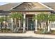 Clubhouse entrance with columns and landscaping at 8932 Manor Loop # 207, Lakewood Ranch, FL 34202