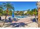 Refreshing pool with surrounding lounge area at 8932 Manor Loop # 207, Lakewood Ranch, FL 34202