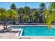 Resort-style pool with clubhouse in background at 8932 Manor Loop # 207, Lakewood Ranch, FL 34202