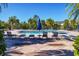 Inviting pool area with lounge chairs and umbrellas at 8932 Manor Loop # 207, Lakewood Ranch, FL 34202