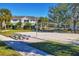 Outdoor sand volleyball court with benches at 8932 Manor Loop # 207, Lakewood Ranch, FL 34202