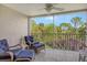 Spacious balcony with seating and tranquil view at 9499 Millbank Dr # 2721, Sarasota, FL 34238