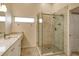 Spa-like bathroom featuring a walk-in shower with glass enclosure and marble tile at 9499 Millbank Dr # 2721, Sarasota, FL 34238