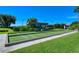 Bocce ball court with green turf and covered seating at 9499 Millbank Dr # 2721, Sarasota, FL 34238