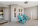 Condo entryway with tiled floor and teal chairs at 9499 Millbank Dr # 2721, Sarasota, FL 34238