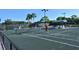 Three women playing tennis on a sunny day at 9499 Millbank Dr # 2721, Sarasota, FL 34238