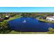 Scenic aerial view of community lake and golf course at 9621 Castle Point Dr # 1024, Sarasota, FL 34238