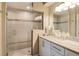 Updated bathroom with a large walk-in shower and modern vanity at 9621 Castle Point Dr # 1024, Sarasota, FL 34238