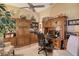 Bright home office features built-in wood shelving and cabinets at 9621 Castle Point Dr # 1024, Sarasota, FL 34238