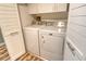 Well-lit laundry room with washer and dryer included at 9621 Castle Point Dr # 1024, Sarasota, FL 34238