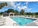 Inviting community swimming pool with lounge chairs at 9621 Castle Point Dr # 1024, Sarasota, FL 34238