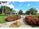 Community pool with lush landscaping and relaxing patio at 9621 Castle Point Dr # 1024, Sarasota, FL 34238