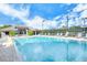 Inviting community pool with plenty of lounge chairs at 9621 Castle Point Dr # 1024, Sarasota, FL 34238