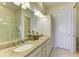 Elegant bathroom with double vanity and granite countertops at 307 Compass Point Dr # 101, Bradenton, FL 34209