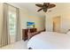 Bedroom with a king-size bed, dresser, and window at 307 Compass Point Dr # 101, Bradenton, FL 34209