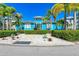 Bright blue community building with landscaping at 307 Compass Point Dr # 101, Bradenton, FL 34209