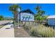 Entrance to Mangrove Walk featuring a wooden sign and boardwalk at 307 Compass Point Dr # 101, Bradenton, FL 34209