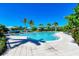 Inviting community pool with lounge chairs and waterfront views at 307 Compass Point Dr # 101, Bradenton, FL 34209