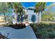 Front entrance with walkway, landscaping and palm trees at 307 Compass Point Dr # 101, Bradenton, FL 34209