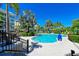 Relaxing kidney-shaped pool with plenty of lounge chairs at 307 Compass Point Dr # 101, Bradenton, FL 34209