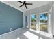 Screened porch with ceiling fan and water views at 307 Compass Point Dr # 101, Bradenton, FL 34209