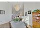 Sunlit dining room featuring a table for four and built-in hutch at 1144 Hoover St, Nokomis, FL 34275