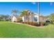 Exterior view of the house with lush landscaping at 1144 Hoover St, Nokomis, FL 34275