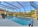 Sparkling pool with a screened enclosure at 1144 Hoover St, Nokomis, FL 34275