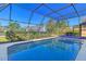 Inviting screened pool with ample deck space at 1144 Hoover St, Nokomis, FL 34275