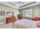 Charming bedroom with floral bedding and wooden furniture at 11816 Altamonte Ct, Venice, FL 34293