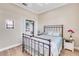 Bedroom with metal bed frame and built-in closet at 11816 Altamonte Ct, Venice, FL 34293