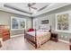 Spacious bedroom with wooden bed and window shutters at 11816 Altamonte Ct, Venice, FL 34293