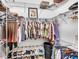 Well-organized closet with hanging rods and shoe storage at 11816 Altamonte Ct, Venice, FL 34293