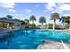 Resort-style pool with patio and lush landscaping at 11816 Altamonte Ct, Venice, FL 34293