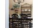 Rustic-style dining room, featuring a wooden table and black chairs at 11816 Altamonte Ct, Venice, FL 34293