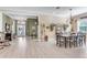 Dining room with a rustic table, chandelier, and entryway view at 11816 Altamonte Ct, Venice, FL 34293