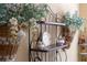 Close-up of a decorative shelf and hanging baskets in the dining area at 11816 Altamonte Ct, Venice, FL 34293